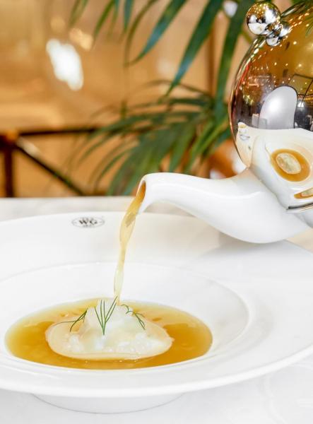 Braised pigeon and tomato consommé served with pigeon confit ravioli and Red Christmas Tea infused caviar Braised pigeon and tomato consommé served with pigeon confit ravioli and Red Christmas Tea infused caviar